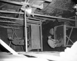 Workmen removing dirt from casemate